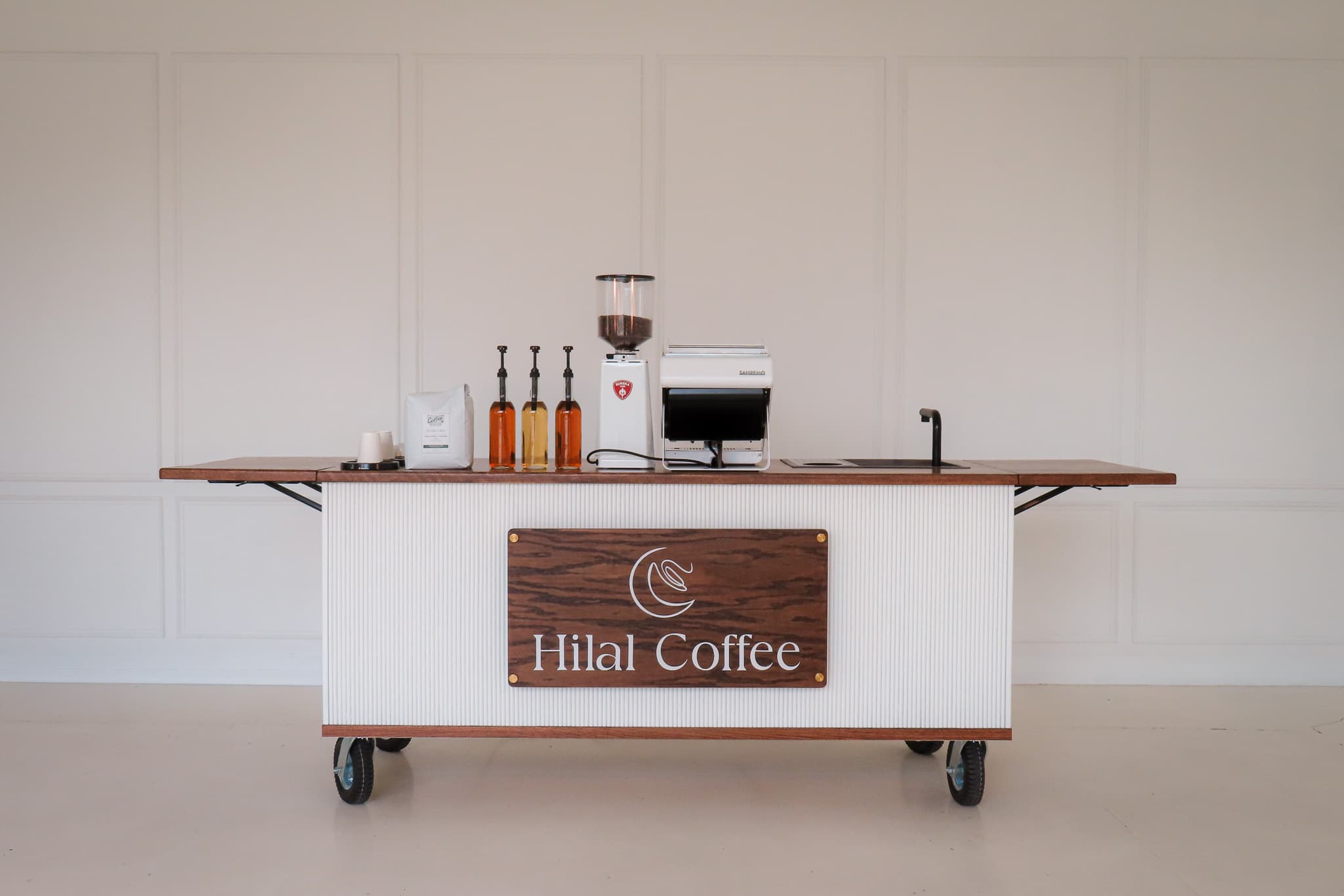 The fully styled Hilal Coffee mobile cart, set up before service