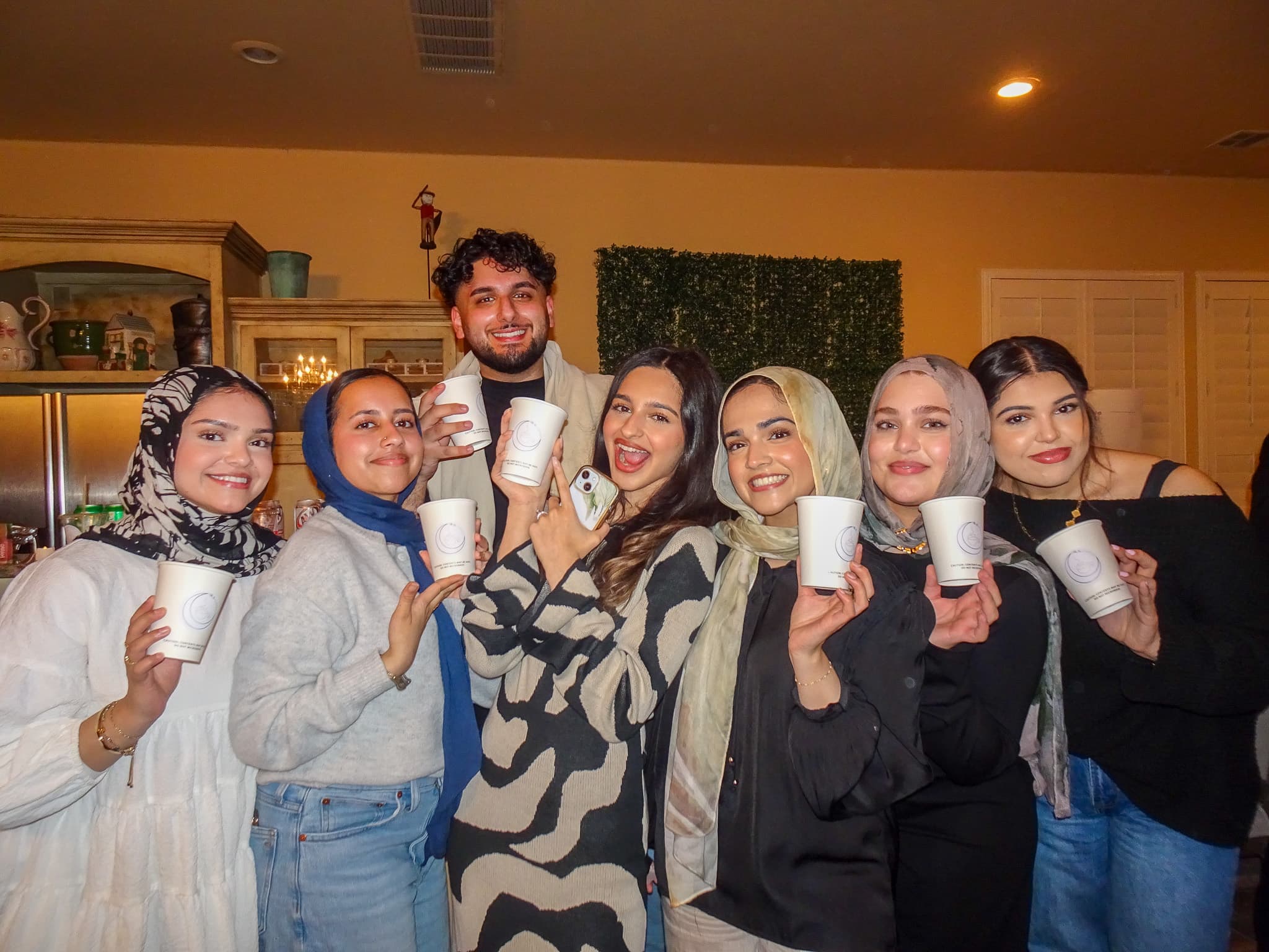 Guests enjoying Hilal Coffee at a small gathering